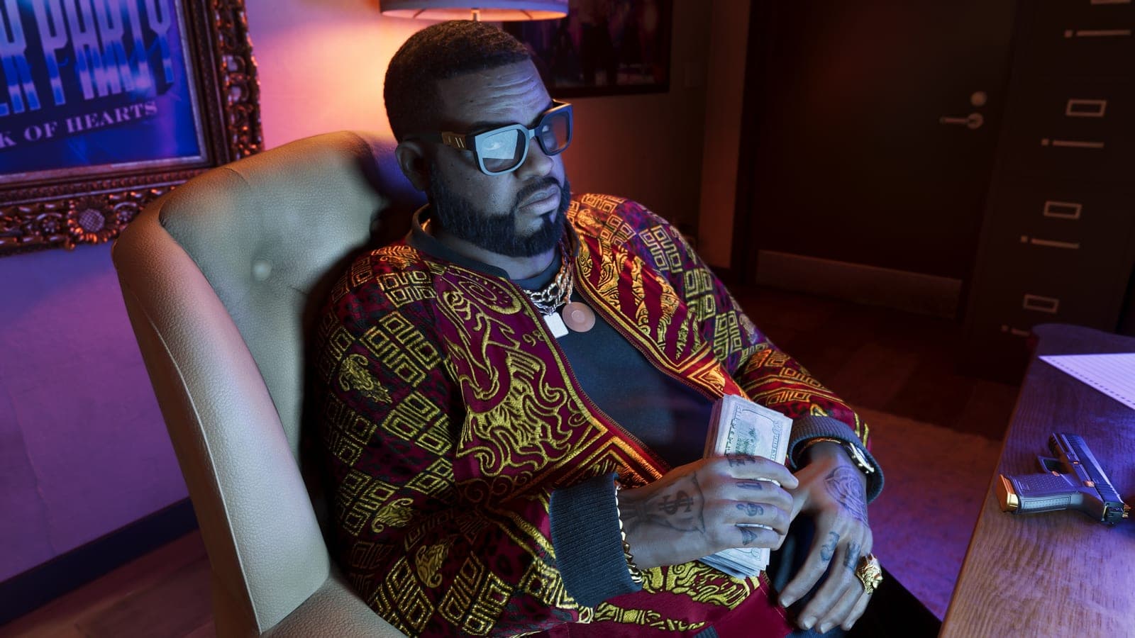 Boobie Ike leaning back in a leather armchair in a red-and-gold embroidered jacket, a stack of cash in one hand and a pistol on the desk.