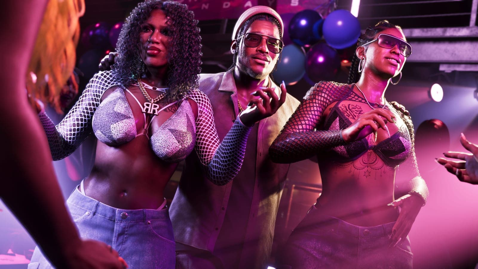 Three club-goers posing shoulder to shoulder under pink and purple stage lights, with balloons and a lighting rig behind them.