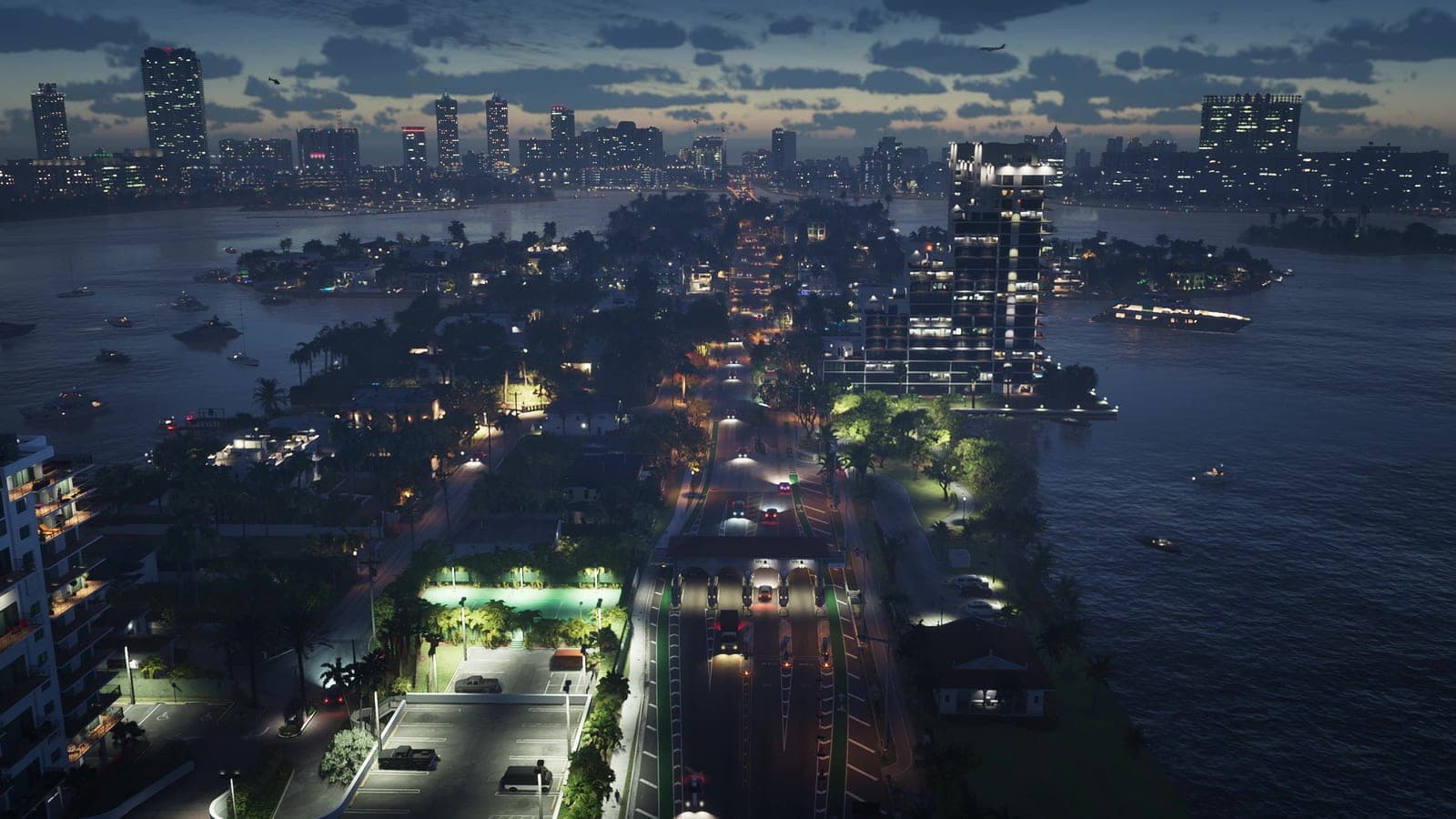 Vice City at night from the air, streets and towers lit up to the horizon.